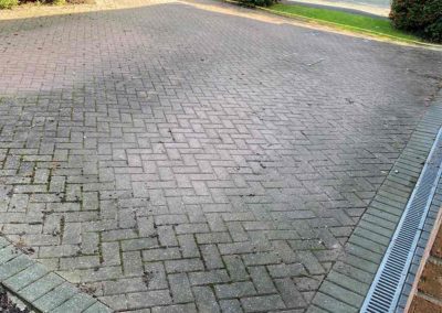 Brick paved parking area before cleaning